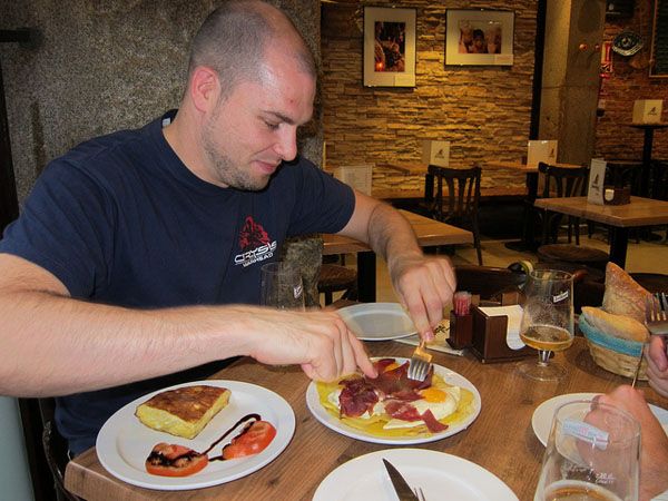 Eating huevos rotos, Madrid Eating huevos rotos, Madrid