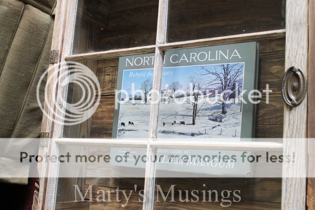 A wooden sign on a window