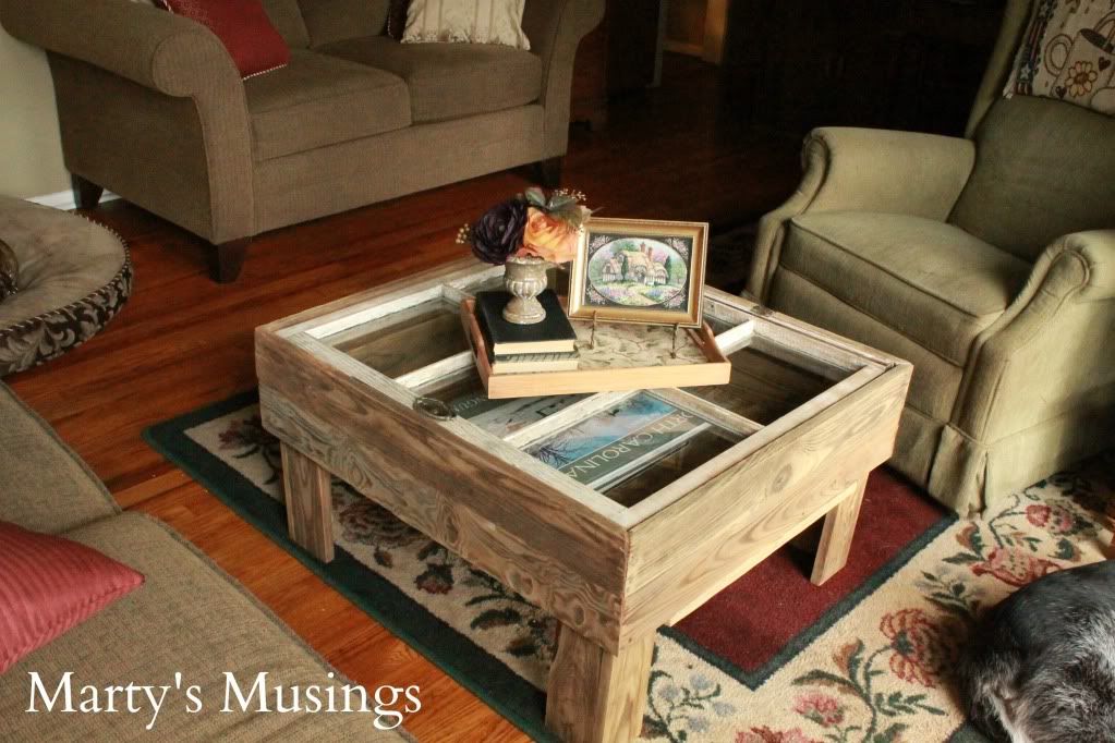 A cat sitting in a living room