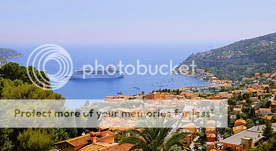 Panorama of small harbor with cruising ship in French riviera
