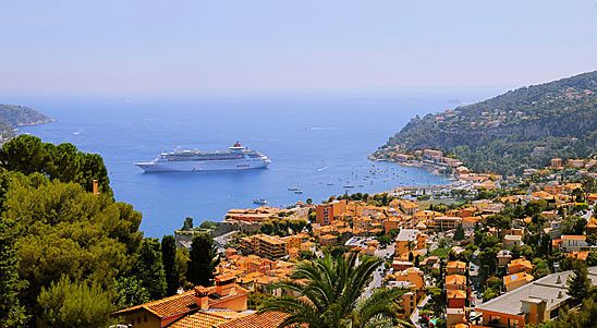 Panorama of small harbor with cruising ship in French riviera